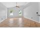 Bright and airy bedroom featuring ample natural light, neutral walls, and tile flooring for a clean and modern look at 2705 Bayview Dr, Eustis, FL 32726