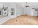 Large bedroom with tile flooring, ceiling fan, and multiple windows, offering a bright and airy space at 2705 Bayview Dr, Eustis, FL 32726