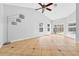 Spacious bedroom with tile flooring, ceiling fan, and multiple windows providing plenty of natural light at 2705 Bayview Dr, Eustis, FL 32726