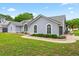 Beautiful single-story home with arched windows, a well-maintained lawn, and fresh landscaping at 2705 Bayview Dr, Eustis, FL 32726