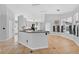 Modern kitchen features gray cabinets, pendant lighting, and a breakfast bar, offering style and functionality for cooking and dining at 2705 Bayview Dr, Eustis, FL 32726