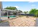 An inviting screened-in pool, a spacious patio area, and lush backyard landscaping create an outdoor oasis at 2705 Bayview Dr, Eustis, FL 32726