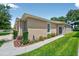 Charming home exterior with walkway, manicured lawn and tasteful landscaping at 27121 White Plains Way, Leesburg, FL 34748