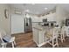 Bright and airy kitchen features white cabinets, granite countertops, and modern appliances at 27121 White Plains Way, Leesburg, FL 34748