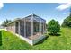 Screened lanai overlooking the yard, perfect for outdoor entertaining at 27121 White Plains Way, Leesburg, FL 34748