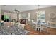 Open-concept living space with an eat-in-kitchen, a living and dining area, perfect for entertaining at 27121 White Plains Way, Leesburg, FL 34748