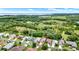 Scenic aerial view of a single-Gathering home with a beautiful yard backing up to a conservation area and lake views at 27302 Stoney Brook Dr, Leesburg, FL 34748