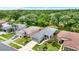 Aerial view showcasing the property's location, landscaping, and surrounding neighborhood at 27302 Stoney Brook Dr, Leesburg, FL 34748