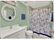 Nautical-themed bathroom featuring a vanity, toilet, and shower/tub combination at 27302 Stoney Brook Dr, Leesburg, FL 34748