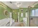 Spacious bathroom featuring a walk-in shower, soaking tub, and dual sink vanity at 27302 Stoney Brook Dr, Leesburg, FL 34748