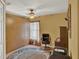 Cozy bedroom with ceiling fan, built-in cabinets and ample natural light at 27302 Stoney Brook Dr, Leesburg, FL 34748