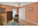 Comfortable bedroom featuring a closet, large window, and bookshelf at 27302 Stoney Brook Dr, Leesburg, FL 34748