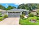 Charming home with a well-maintained lawn and inviting front entrance at 27302 Stoney Brook Dr, Leesburg, FL 34748