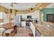 Stainless steel appliances and granite countertops create a modern and functional kitchen space at 27302 Stoney Brook Dr, Leesburg, FL 34748