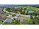 Wide aerial shot displaying the community, with a golf course, tennis courts, and well-maintained streets at 2954 Heiny Pl, The Villages, FL 32163