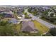 Neighborhood scene of homes with lawns and mature landscaping including trees and shrubs at 2954 Heiny Pl, The Villages, FL 32163