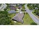 An aerial view of the rear of the home with lush green landscaping in a well-kept neighborhood at 2954 Heiny Pl, The Villages, FL 32163
