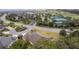 Image of a home with a large grassy lawn and mature landscaping in a well-maintained neighborhood at 2954 Heiny Pl, The Villages, FL 32163