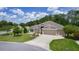 Aerial view of a home showcasing a well-manicured lawn and beautiful landscaping at 2954 Heiny Pl, The Villages, FL 32163