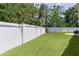 Lush backyard with a tall privacy fence and plenty of space for recreation and relaxation at 2954 Heiny Pl, The Villages, FL 32163