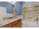 Bathroom featuring a vanity, toilet, and tiled shower with a bathtub at 2954 Heiny Pl, The Villages, FL 32163