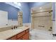 Bathroom with tile surround tub and granite vanity at 2954 Heiny Pl, The Villages, FL 32163