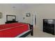 Bedroom featuring a ceiling fan, neutral walls, carpet floors, and access to the walk-in closet at 2954 Heiny Pl, The Villages, FL 32163