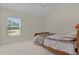 Bedroom with a vaulted ceiling, carpet, and a large window providing natural light at 2954 Heiny Pl, The Villages, FL 32163