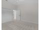 Spacious bedroom with closet and adjoining doorway at 2954 Heiny Pl, The Villages, FL 32163