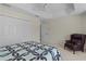 Bedroom with an accent chair, closet, and a ceiling fan at 2954 Heiny Pl, The Villages, FL 32163
