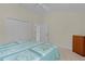 Bedroom with closet, ceiling fan, and neutral paint at 2954 Heiny Pl, The Villages, FL 32163