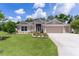 Charming one-story home with well-manicured lawn and inviting curb appeal at 2954 Heiny Pl, The Villages, FL 32163