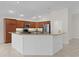 Modern kitchen featuring stainless steel appliances, granite countertops, and a breakfast bar at 2954 Heiny Pl, The Villages, FL 32163