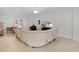 Comfortable living room with an open layout, neutral walls, and a large sectional sofa at 2954 Heiny Pl, The Villages, FL 32163
