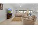 Spacious living room with tile flooring, a comfortable reclining sofa, and a ceiling fan at 2954 Heiny Pl, The Villages, FL 32163