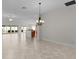 Bright, open living space connecting kitchen and living areas at 2954 Heiny Pl, The Villages, FL 32163