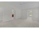 Spacious main bedroom with neutral carpeting and multiple doorways for easy access at 2954 Heiny Pl, The Villages, FL 32163