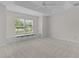 Large main bedroom boasting a tray ceiling, ceiling fan, and window bench seating at 2954 Heiny Pl, The Villages, FL 32163