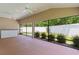 Screened patio with ceiling fans and view of the fenced yard at 2954 Heiny Pl, The Villages, FL 32163