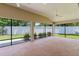 Covered patio with ceiling fan offering views of the private backyard at 2954 Heiny Pl, The Villages, FL 32163