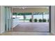 Indoor / outdoor patio with bar top counter, screens, and ceiling fans at 2954 Heiny Pl, The Villages, FL 32163