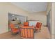 Relaxing covered patio with comfortable seating, views into the living room, and an outdoor bar at 2954 Heiny Pl, The Villages, FL 32163