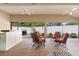 Inviting covered patio featuring comfortable seating and an outdoor bar area for entertaining at 2954 Heiny Pl, The Villages, FL 32163