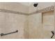 Modern shower with neutral-toned tiles, mosaic accent, and built-in niche at 2954 Heiny Pl, The Villages, FL 32163