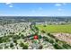 Expansive aerial view of a residential community with lush greenery and beautiful landscaping at 2991 Saint Thomas Ln, The Villages, FL 32162