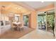 Elegant dining area with views of lanai, sliding glass doors, and neutral color palette at 2991 Saint Thomas Ln, The Villages, FL 32162