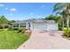 Charming single-story home featuring well-manicured landscaping and a three-car garage at 2991 Saint Thomas Ln, The Villages, FL 32162