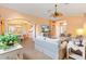 Open living room with a dining area and a glimpse of the front entryway at 2991 Saint Thomas Ln, The Villages, FL 32162