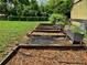 Backyard featuring terraced planter beds ready to be filled with plants and flowers at 30604 Apawamis Dr, Sorrento, FL 32776