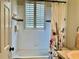 Bathroom with a tub and shower and tiled walls at 30604 Apawamis Dr, Sorrento, FL 32776
